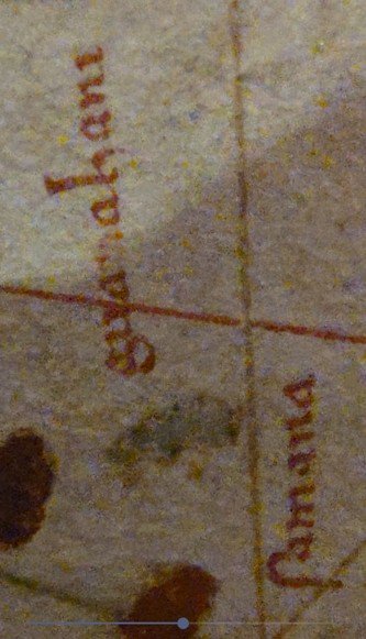 Close-up photograph through a magnifying glass of the Guanahani island depiction on the Juan de la Cosa map, 1500, Museo Naval, Madrid