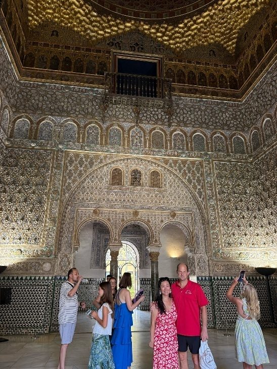 The Hall of Justice at the Alcázar of Seville, with a central fountain and ornate gilded ceiling