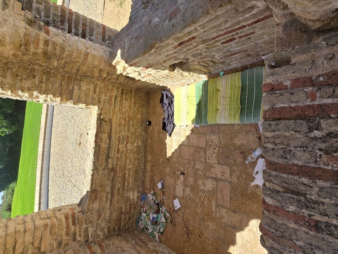 The dry basin of La Fontanilla today, showing signs of use as an informal shelter