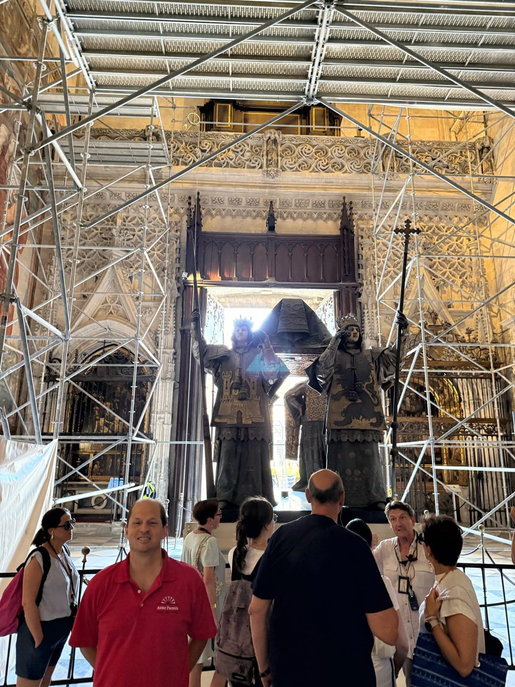 Crowds gathered around the elevated tomb of Christopher Columbus inside Seville Cathedral